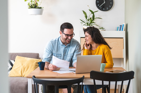 happy couple processing payments